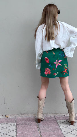 Mini skirt with crystals and pockets