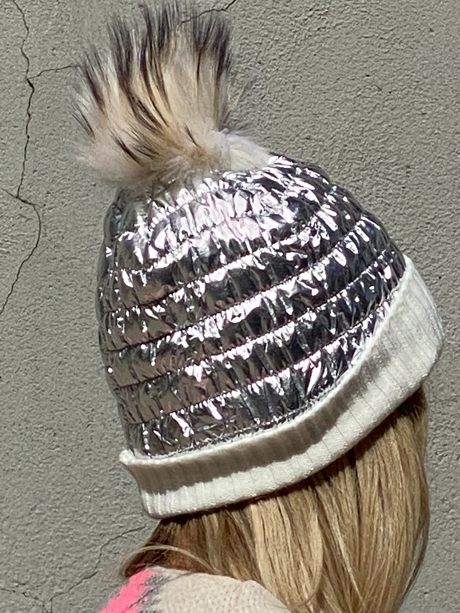 Metallic hat lined with natural leather tassel