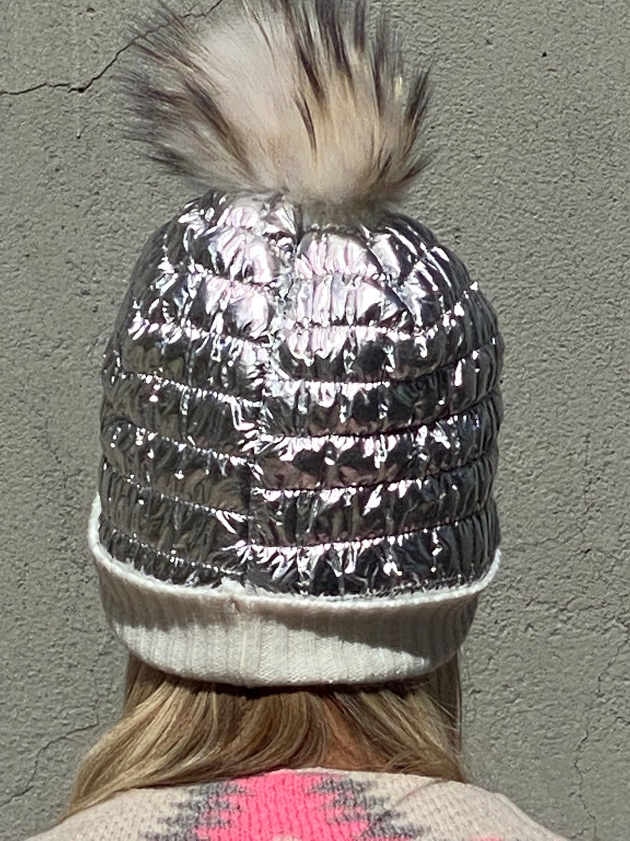 Metallic hat lined with natural leather tassel